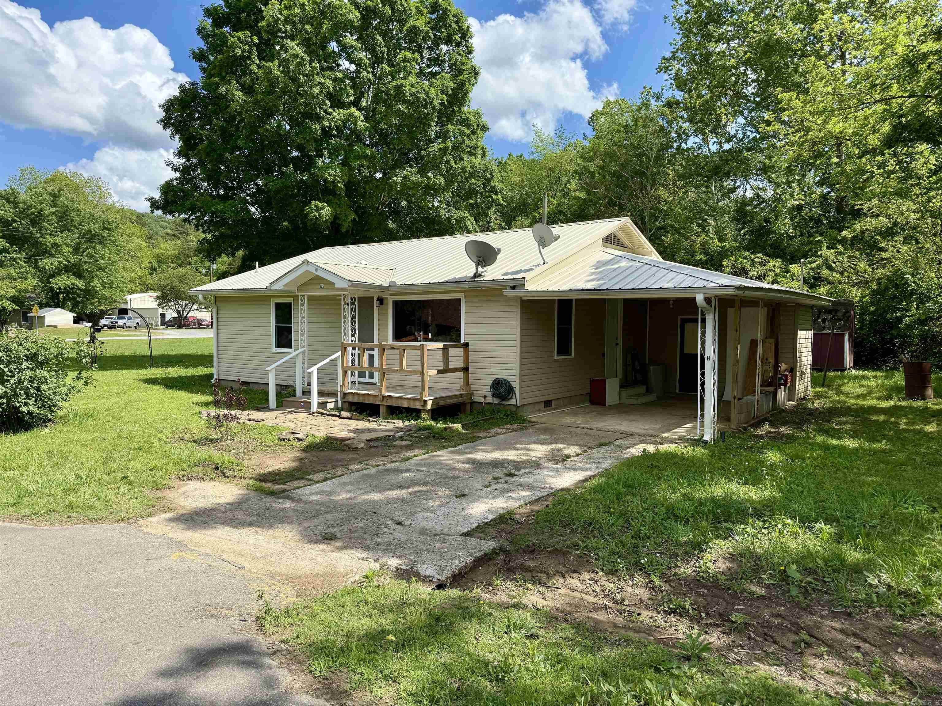 This charming 3-bedroom, 1-bath home in the heart of Heber Springs is perfect for first-time buyers or a great rental investment. It features hardwood floors throughout most of the home, a newer metal roof, siding, and windows. Recent updates include fresh paint, new fixtures, new landscape lighting, a brand-new water heater, and completed foundation leveling for peace of mind. Enjoy the large, serene yard with a creek—your own peaceful retreat just steps from your door. With its prime location and recent upgrades, this home is move-in ready and full of potential. Have the convenience of being in town but close to multiple access to points to Greers Ferry Lake and the Little Red River. Large corner lot, plenty of space for a shop and or additional living quarters. Take a look.
