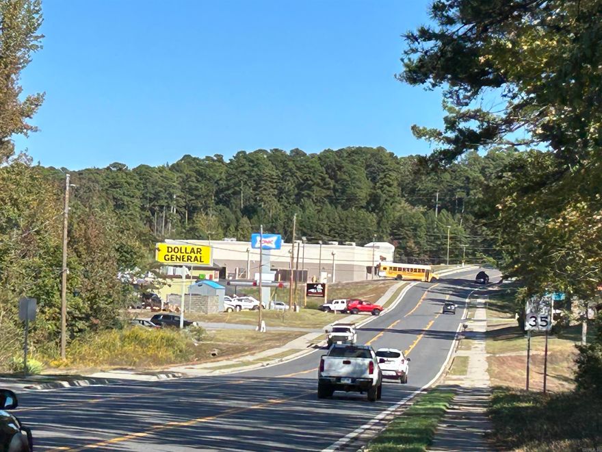 Commercial lot offering 8.5+- acres with 504 feet of frontage on Highway 7 North.  The property features two commercial driveway cuts into curb and sidewalk.  There is an old home on the proeprty that is uninhabitable and of no value.  There is already water, electric and gas connections available on the property.  Three phase power is available nearby.  Only 0.4 miles north of main entrance to Hot Springs Village and 0.4 miles south of State Highway 192 intersection.  Offers great visiability and access in both directions.