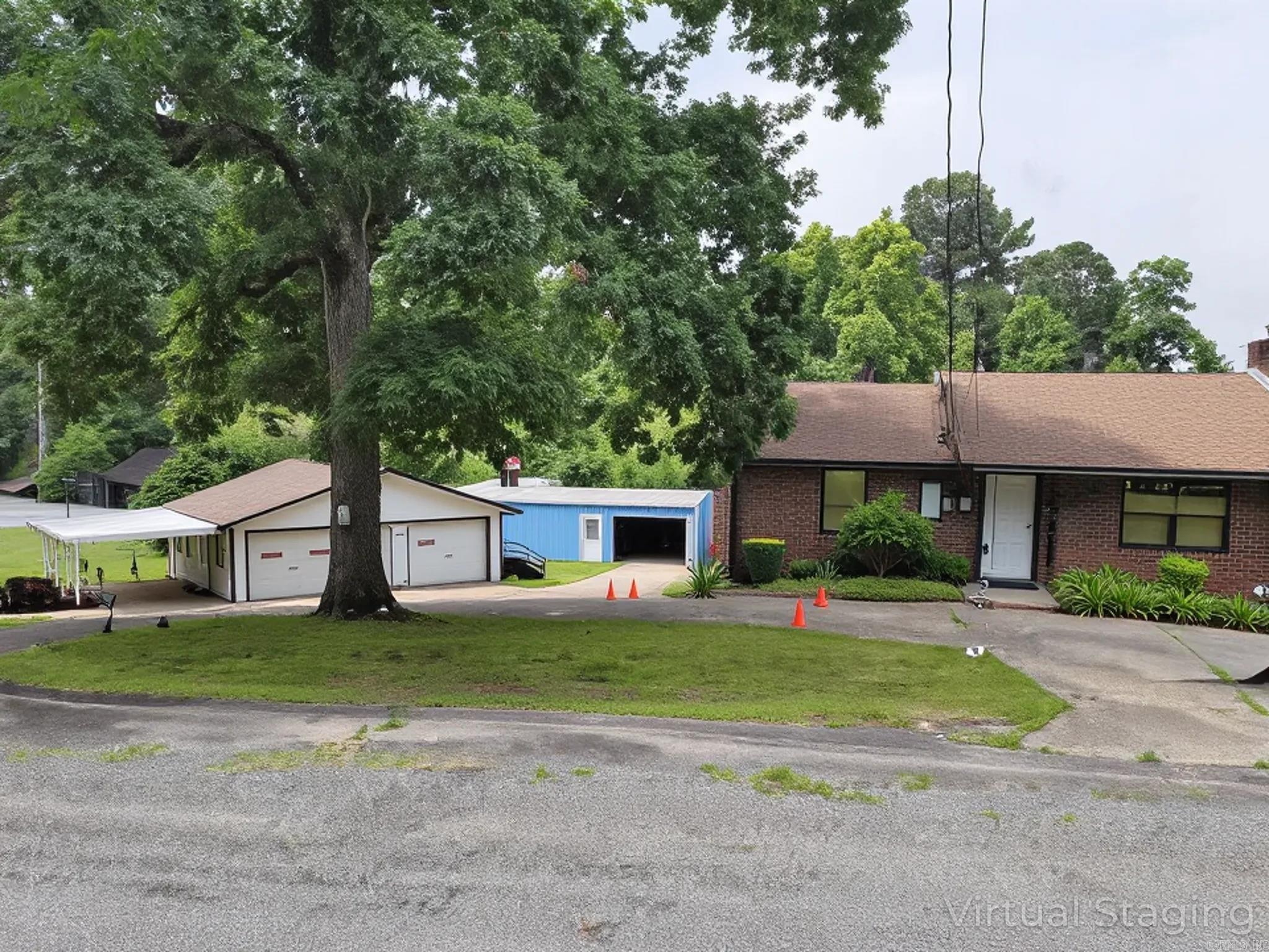 This property has tons of rental potential. Besides the main floor, the main house's basement could be rented out as a studio apartment. It has a bathroom, kitchen, bedroom/living room. There is a very large workshop that could be a mechanic/woodworking business or similar, but this shop also has a kitchen and bathroom, so it could be rented out separately too. The 2-car garage is basically an unfinished house. It has electrical, but needs plumbing. In total, there could be 4 residential rentals here plus 1 business lease. (square footage is estimate.)