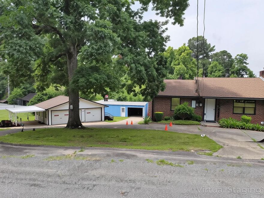 This property has tons of rental potential. Besides the main floor, the main house's basement could be rented out as a studio apartment. It has a bathroom, kitchen, bedroom/living room. There is a very large workshop that could be a mechanic/woodworking business or similar, but this shop also has a kitchen and bathroom, so it could be rented out separately too. The 2-car garage is basically an unfinished house. It has electrical, but needs plumbing. In total, there could be 4 residential rentals here plus 1 business lease. (square footage is estimate.)