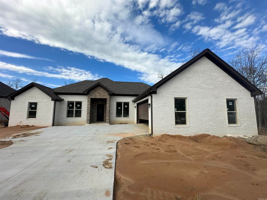 This brand new construction home is the epitome of modern luxury. With its open concept design, you'll feel right at home as soon as you step inside. The home is flooded with natural light thanks to its big windows, making it feel bright and airy. Stainless steel appliances and stunning granite countertops adorn the kitchen, making it the perfect place to whip up a delicious meal. The LVP flooring is not only stylish but highly durable, making it a great option for families with pets or young children. The double vanities in the bathroom provide ample space for getting ready in the morning, and the separate shower offers a spa-like experience. The living room boasts a beautiful view, making it the perfect place to relax and unwind. The huge garage and extra storage space provide ample room for all your belongings, and the covered back porch is the perfect place to enjoy your morning coffee or entertain guests. And let's not forget about the gas cook top - perfect for the home chef who loves to cook with precision. Don't miss out on the opportunity to call this stunning new construction home your own!