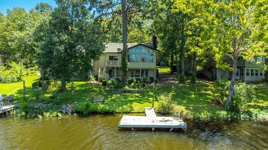 Enjoy lakefront living in this cozy 2BR/2BA townhouse located in the heart of Hot Springs Village the largest gated community in the U.S.! Perfect for downsizers or those seeking a peaceful retreat, this home offers a flexible and spacious layout with a living room, a separate den for relaxing or working from home, and a bright sunroom with serene views of the lake. Recent updates include a brand-new HVAC system installed in 2024 for year-round comfort. Step outside to enjoy lakeside strolls, or take advantage of the incredible amenities Hot Springs Village has to offer from golf courses and nature trails to lakes and community events. This low-maintenance lakefront gem blends convenience, comfort, and charm in a secure, vibrant community. Don't miss your chance to live the lake life!