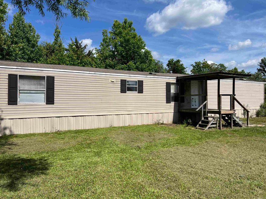 Charming Clayton 2011 single wide mobile home located on a spacious 2.10-acre lot at the quiet end of a lane, offering privacy and plenty of outdoor space. This comfortable home features three bedrooms and two bathrooms, making it ideal for comfortable living or guests. There is also a convenient shop area, perfect for workshops, storage, or hobbies. The property is just about six miles from scenic Ward Lake, with easy bike trail access nearby, and only minutes from Mena town center for shopping and dining. Outdoor enthusiasts will appreciate the close proximity to the beautiful Ouachita Mountains and Lake Wilhelmina, which is renowned for excellent fishing and recreational opportunities. This property offers a peaceful rural lifestyle while remaining close to natural beauty and town amenities. Contact us today to schedule a showing and experience all this home and location have to offer.