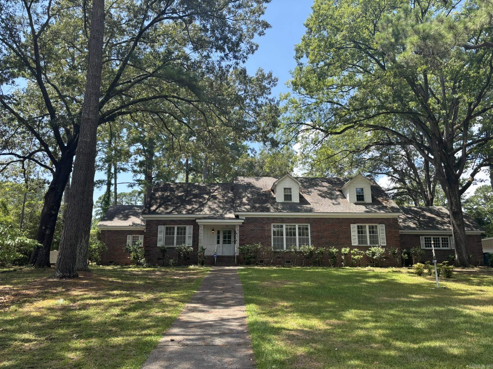 This beautiful brick home offers high ceilings, gleaming wood floors, & abundant space for comfortable living. Step into the formal living room w/ a cozy fireplace, entertain in the spacious formal dining room, or relax in the nice-sized family room. The well-appointed kitchen features double ovens, a gas cooktop, dishwasher, & a large walk-in pantryāperfect for the home chef. 3 bedrooms are located on the main floor, w/ 2 additional bedrooms upstairs. Most bedrooms include walk-in closets for great storage. Recent updates include 2 new water heaters (50-gal. Gas & 40-gal. Electric, both replaced in July ā25), a whole-house generator just a few years old, & a replaced main water line from the house to the street (+ partial sewer line replacement). Outside, enjoy the landscaped oversized lot, complete w/ a large gazebo for outdoor gatherings. An attached double garage w/ attic access & a detached double garage/shop at the rear provide plenty of parking & workspace. This property needs some TLC, but is loaded with potential & ready for your personal touch ā donāt miss your chance to make it yours!