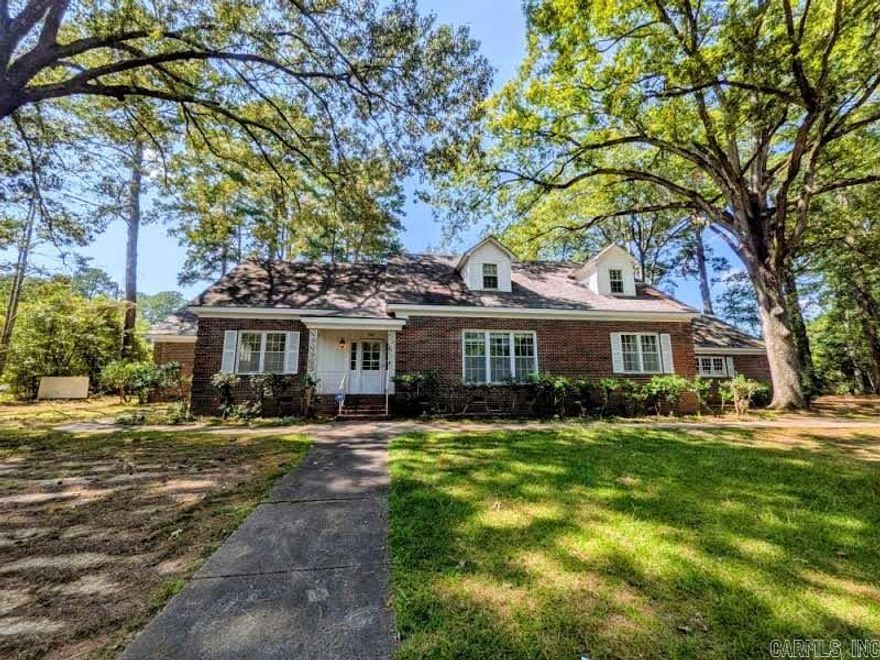 This beautiful brick home offers high ceilings, gleaming wood floors, & abundant space for comfortable living. Step into the formal living room w/ a cozy fireplace, entertain in the spacious formal dining room, or relax in the nice-sized family room. The well-appointed kitchen features double ovens, a gas cooktop, dishwasher, & a large walk-in pantry—perfect for the home chef. 3 bedrooms are located on the main floor, w/ 2 additional bedrooms upstairs. Most bedrooms include walk-in closets for great storage. Recent updates include 2 new water heaters (50-gal. Gas & 40-gal. Electric, both replaced in July ‘25), a whole-house generator just a few years old, & a replaced main water line from the house to the street (+ partial sewer line replacement). Outside, enjoy the landscaped oversized lot, complete w/ a large gazebo for outdoor gatherings. An attached double garage w/ attic access & a detached double garage/shop at the rear provide plenty of parking & workspace.   This property needs some TLC, but is loaded with potential & ready for your personal touch – don’t miss your chance to make it yours!