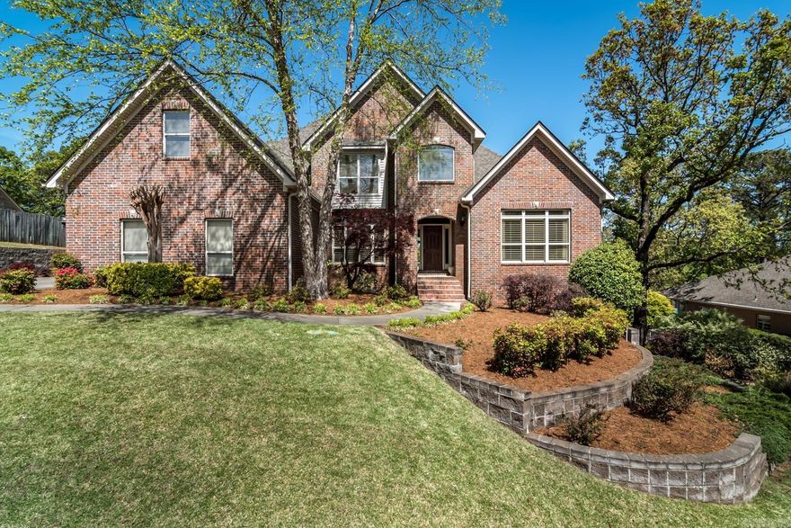 Welcome to this beautiful Chenal Valley home! Classic brick exterior and mature landscaping exude classic charm. The entry leads past an inviting office and formal dining room, opening to the spacious great room featuring a vaulted ceiling and cozy fireplace with gas logs. The great room flows seamlessly into the kitchen, creating an ideal space for both casual gatherings and formal entertaining. The gourmet kitchen features new granite countertops and backsplash, a prep island and a generous breakfast room plus bar with seating overlooking the backyard. The appliances include a new GE cooktop (2019), double ovens, microwave (2019), trash compactor, dishwasher (2015) and a walk-in pantry.  Retreat to the main level’s private primary bedroom suite with new carpet! Upstairs offers 3 spacious bedrooms, 2 bathrooms, and a game room! Deck overlooking the backyard! Three car garage!  New roof (2023), encapsulated crawl space, hot water heaters (2019), a new heating and air system (2019), refinished hardwood floors plus much more! One of the neighborhood pools is across the street from the entrance of Bayonne!