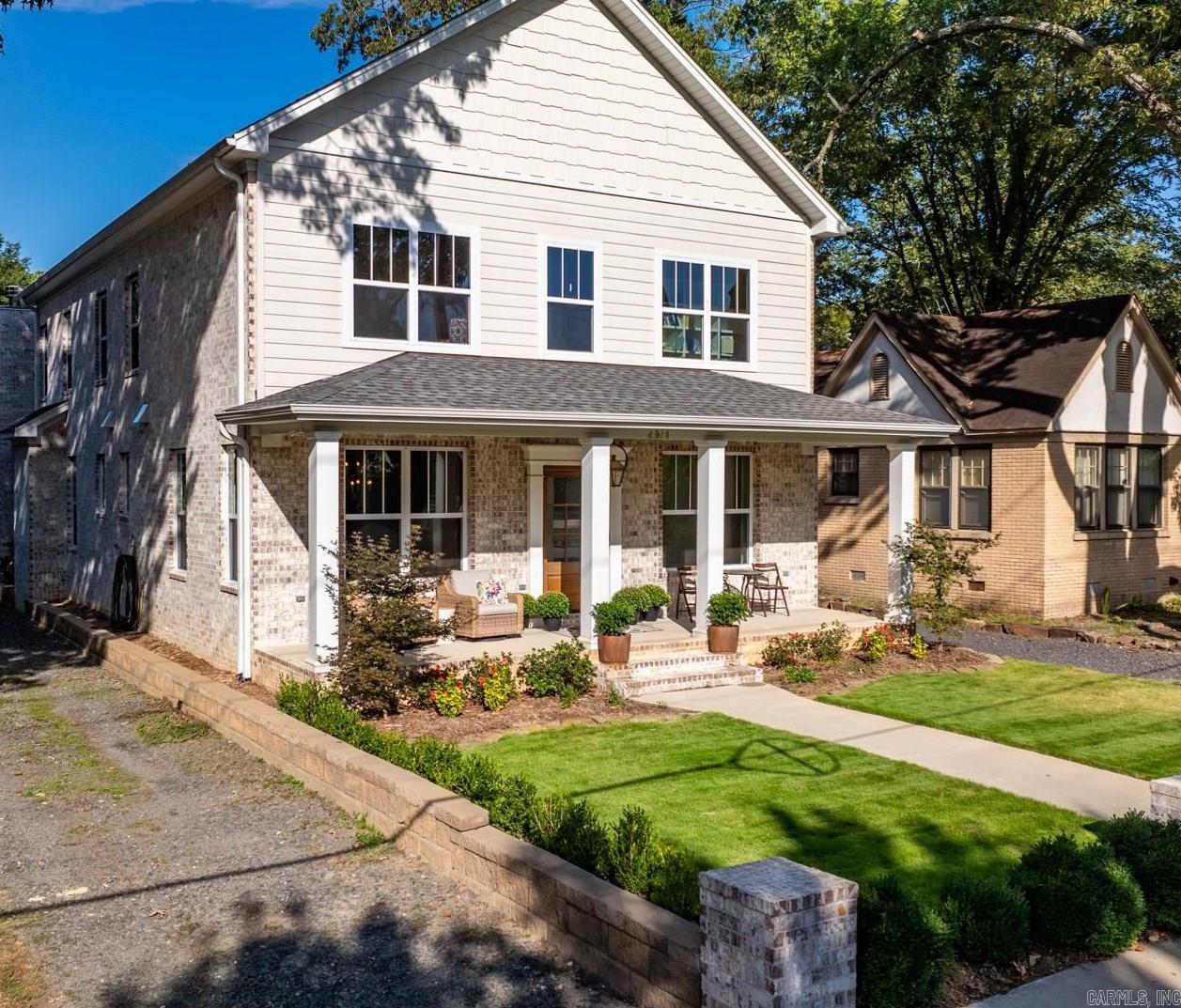 Newer Heights construction with fantastic layout! Wonderful windows allow tons of natural light into this two year old home. Tall ceilings, pretty hardwoods, & wonderful finishes are all throughout. Off of the alley in the back of the house is entry into a large two car garage and space for four more cars to park! Wonderful back porch with fireplace & vaulted wood ceiling with wood beams! Just beautiful! (AND hookups already there to easily add an outdoor kitchen!) Covered front porch allows a fun place to watch all the fun happening in the vibrant Heights neighborhood! The large marble kitchen island has bar seating and across is a bar/storage area with pretty green paint. Large gas stove. The primary bed is on the main level with a big walk in closet and lovely bath with double vanity. There is a formal dining room with great looking wallpaper, a small desk space and gorgeous half bath also downstairs. Upstairs are 3 bedrooms, one en-suite and 2 beds that share a jack & jill bath, all with walk in closets! There is a second laundry upstairs. Also, there is a 5th bedroom and bathroom (wired & plumbed just needs finish out - seller has a quote) if someone wants a 5th bedroom!