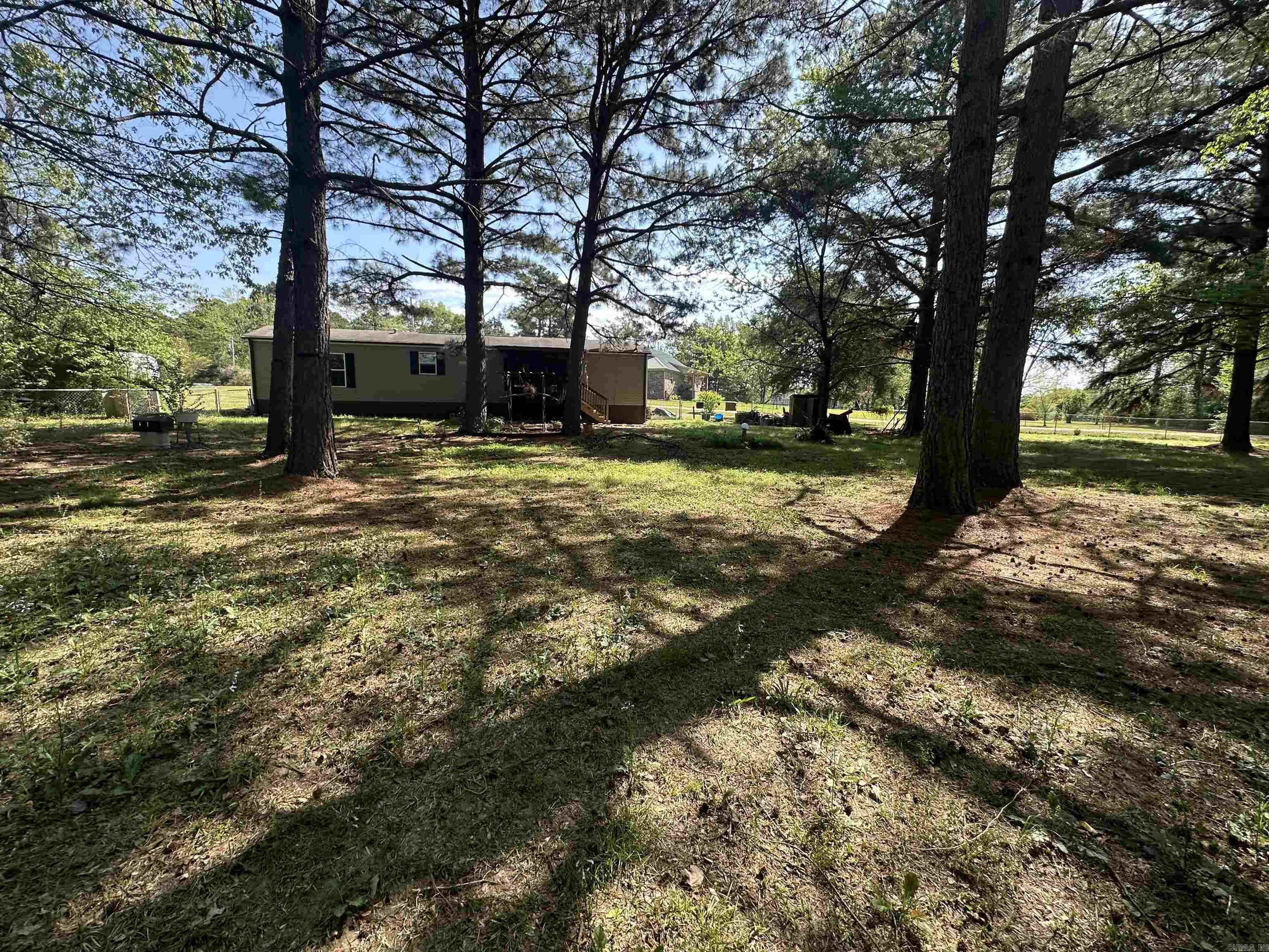 cute 2 bed 2 bath on 2.55 acres. Home is maintenance free and in great condition. large fenced in back yard with screened in porch. Property has a large storage shop on it as well.
