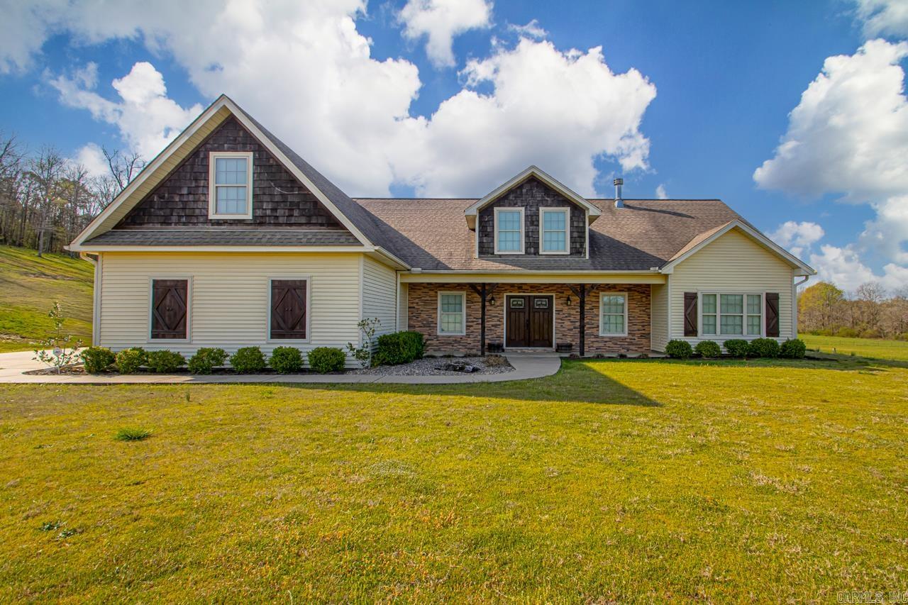 Country Living At Its Finest With Ample Space .... Amenities Include: Approximately 2440 Square Feet, 4 Bedrooms, 2 1/2 Bathrooms, 4th bedroom/Bonus Room, Great Room with Wood Burning Fireplace, Built-ins, Large Kitchen with plenty of Cabinets and Island, Built in Pantry, Office Room, Laundry, Granite Counter Tops, Tile in Wet Areas, Patio overlooking back property, 2 Car Side Load Garage, 20 x 30 Shop with overhang, Level 4.22 acres cleared and partially fenced, Bryant Schools.... And Much More... A Must See....