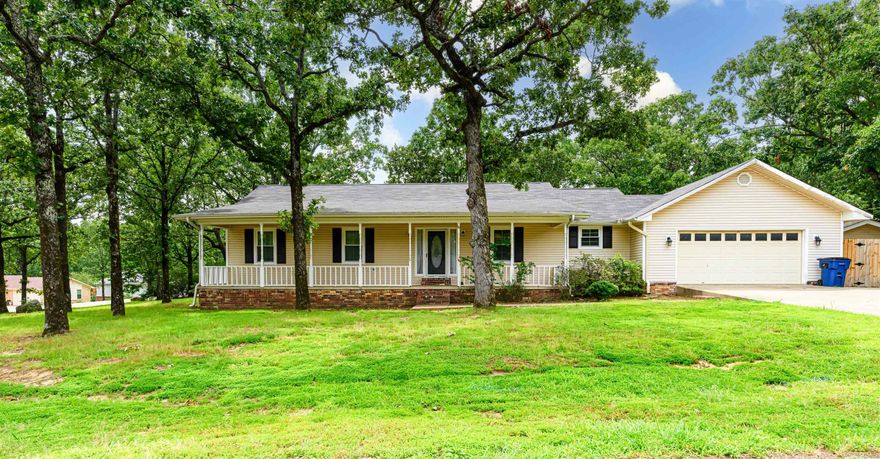 Situated on a large corner lot this nice, move in ready 3 bedroom, 2 bath home is the perfect place to call home. Large kitchen and dining area are great for entertaining and opens up to the spacious living room with cozy brick fireplace. All bedrooms are a good size. Bathrooms have been updated. New windows in 2023. No carpet and floors are pet friendly and kid friendly. Enjoy quiet and serene mornings or nights on the oversized porch or spacious deck. Agents see remarks.