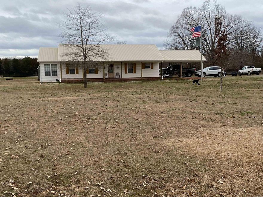 Back on the market - buyers financing fell though, no fault of the sellers. Country home on 1 acre lot.  Spacious 2 bedroom, 2 bath with a sunroom.  Updated home, easy to live in!  Nice 8X12 storage building in the back stays. Updates include gutters, new posts on front porch, new shutters on outside of home, stained concrete in kitchen and living room, accent wall in living room, new 8/2021 a/c & heating system (3.5 ton unit).