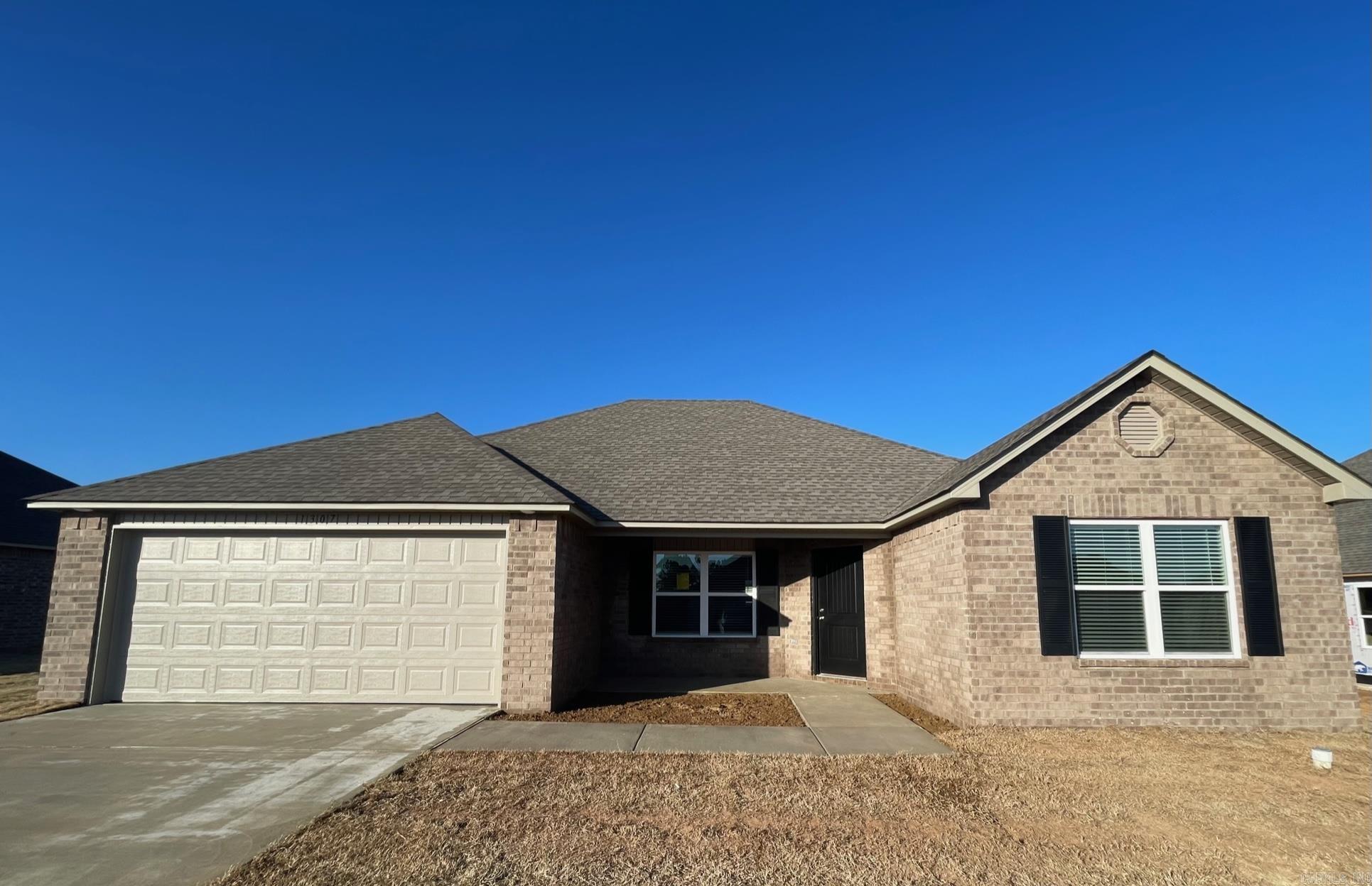 Carson plan Upgrades included in this home: both sides brick, 14x10 covered patio, 8/12 roof with architectural shingles, 60" standup fiberglass shower in Master Bath, toilet upgrade, plumbing faucet upgrade 2, 8" deep Kitchen sink, HVAC rigid duct upgrade, crown on Kitchen cabinets, full width single vanity cabinet base in Master Bath, cabinet hardware level 1, 16" laminate bar top, Luxury Vinyl Plank flooring in wet areas and Living Room and adjacent hallways, raised ceilings in Living Areas per municipal requirements, faux wood blinds throughout home, Cheyenne style interior doors, baseboards level 2, crown molding in whole house, window sills in whole house, attic stairs, LED disk lights in Kitchen, Level 1 ceiling fans in Living Room and Master Bed, full sod, stainless steel appliance package.