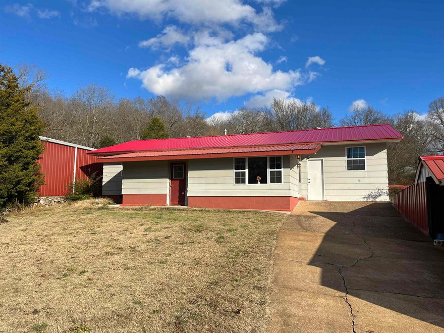 NEW ROOF DECEMBER 2023!!! Discover the charm of this 3-bed, 2.5-bath haven featuring a well lit sunroom. The man of your home will fall in love with the 30x40 garage that is wired for 220, has two large doors, and a concrete floor; along with the large covered carport you could house upto 8 vehicles! After a long day in the yard or shop, access a convenient mudroom that has all the amenities of a half bath; in this room you also find a movable wall that hides a large fireproof gun safe. A 500 covered propane tank, stove, and refrigerator coveys. Perfectly located minutes away from Spring River, restaurants, and downtown shopping, offering an ideal location for a small business. Accesseble and designed for comfort, this home awaits its next owner. Motivated seller-seize the opportunity!