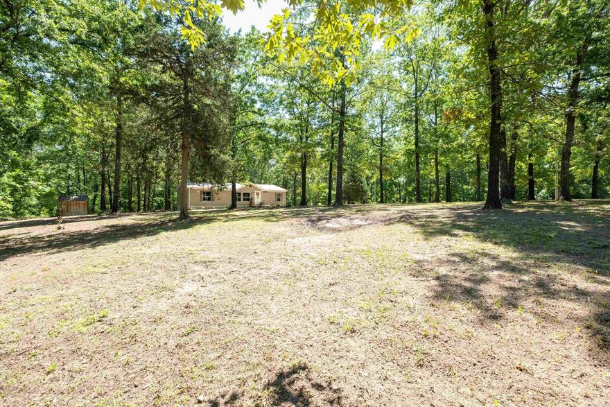 Welcome to this beautifully remodeled manufactured home on 3.24 peaceful acres in Saline County! This spacious 3-bedroom, 2-bath double wide offers a bright and open floor plan perfect for comfortable country living. The home features a stunning kitchen remodel, newer HVAC units (inside and out, 2021), and a new hot water heater (2021) for modern efficiency. A durable metal roof adds peace of mind, and the fenced-in area is ideal for pets or gardening. Surrounded by mature trees and natural beauty, this quiet oasis offers breathtaking sunset views from your windows—making every evening feel like a retreat. A storage building is also included for added convenience. Don’t miss the chance to enjoy serene country living.