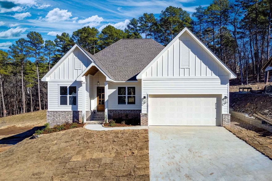 Gorgeous new construction in Chenal Valley! One level home backs to green space AND is in a cul de sac. Wonderful open floor plan with hardwood floors throughout including bedrooms. Beautiful fireplace with custom mantel and tile. The kitchen features Frigidaire appliances including a five burner gas cooktop. There is a walk in pantry and breakfast bar. Enjoy the dining room with a chandelier and the breakfast room. There are three bedrooms plus an office.  Outstanding fixtures and finishes. Covered back porch to enjoy the yard. Don't miss the walk up attic off the garage!  Convenient location close to walking trails, shopping, schools, churches, pools and Pinnacle Mountain State Park!