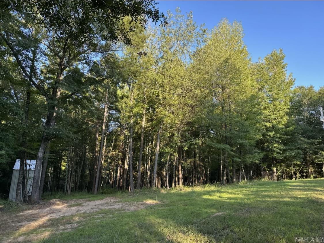 A beautiful residential lot of 5.32 acres near the Middle Fork Red River with lots of trees and wildlife like deer, turkeys and small game. This property has a set of gates and a insulated well house hooked to electricity and a nice circle drive and great building site. You can hunt and it's not far to a boat launching area to go fishing . This could be a great weekend get away or build your retirement home . This is a must see property and it's not far from all of Fairfield Bay Resort City amenities . The lot is subject to probate . We are selling the whole 5 acres as a residential lot .