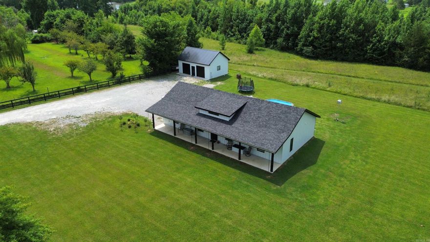 Nestled in the charming town of Batesville, Arkansas, this modern 3-bedroom, 2-bath home features 1624 square feet of living space and exudes contemporary elegance and comfort. The heart of the home is its expansive open floor plan, featuring a sleek, commercial-grade kitchen equipped with top-of-the-line appliances and stunning granite countertops. Each bedroom offers a spacious retreat, while the baths are designed with modern fixtures and finishes for a luxurious experience.  Beyond the main house, a finished garage building, encompassing 600 square feet, provides an ideal space for a guest house or a comfortable mother-in-law setup. This property boasts 2.21 acres of lush land, perfect for outdoor activities and family gatherings. A custom-built wood fence runs along the highway, adding a touch of rustic charm to the yard. This property is a perfect blend of modern amenities and serene country living, making it an ideal choice for those seeking a refined yet relaxed lifestyle in Batesville, Arkansas. Listed for only $349,900!