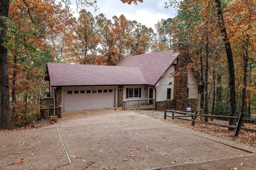 Centrally located in Hot Springs Village you will find this gem on Lake Coronado with a spacious lot, approximately 165 ft of lake frontage, covered boat dock with lift and great shore line fishing. The vaulted great room/dining area opens to the sun room with fabulous windows giving you an unbelievable view. Enjoy the the view as well from the kitchen with granite counters. Breakfast area with large slider to the upper deck. Divided bedrooms gives everyone the privacy desired. Primary bedroom with walk in closet. Second guest bedroom also has walk in closet. Third bedroom currently used as office with sliding glass door to the upper deck and views of the lake. The lower deck fantastic for entertaining. Be sure to check out the additional room under the home for great storage. Two car garage with extra storage. This property comes to life in the spring with multiple Dogwood trees for you to enjoy. Roof 2018. NO SELLERS DISCLOSURE. See Agent Remarks.