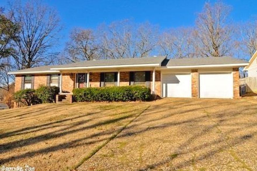 NEW paint throughout - painted paneling and wall paper removed! Some new lighting. Beautiful brick exterior features classic black shutters and red front door. New roof in '10. Inside you'll find 2 living spaces -a large living/ dining room and a hearth room open to kitchen. Hardwoods floors in the bedrooms and tile in the wet areas. In laws quarters with separate entrance and parking make this Indian Hills home a must see! New HVAC in '12. One year home warranty included!