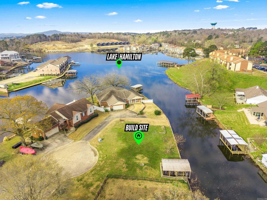 Premium Lake Hamilton frontage meets convenience and lifestyle with approx. 129 ft of shoreline in the highly sought after Lakeside School District. This cleared, BUILD-READY lakefront in Hot Springs, Arkansas is already improved with a concrete and rock seawall and a covered boat dock with lift-making it easy to start enjoying Lake Hamilton immediately. Positioned in a peaceful cove, the property offers a balance of privacy and quick access to open main channel water. Searching for Lake Hamilton lakefront land, a boat dock property, or a homesite on the water in Hot Springs, this location delivers.  By car OR boat, you're just minutes to Carpenter Dam Road, Malvern Ave and downtown Hot Springs.   City utilities are available at the street, making building your dream lake home a breeze.  Ideal for a primary residence, vacation home, or investment property, this Lake Hamilton lot with boat dock is a STANDOUT opportunity in on of Hot Springs' most desirable waterfront areas.