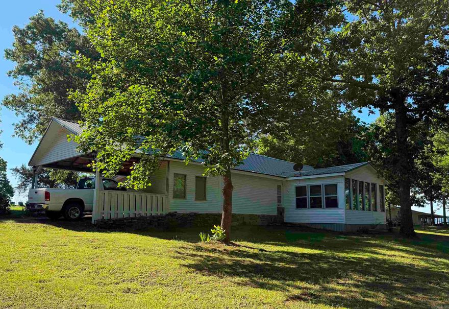 This cozy traditional style two bedroom and two bathroom home is in the heart of Greers Ferry.  Minutes away from the Greers Ferry Lake and both Shiloh and Narrows Marina's.   This home features a breakfast bar, beautiful sun room, the yard has two new fenced off areas with a gates for vehicle access.   This home is walking distance to the Greers Ferry ball park,  with basket ball court, play ground and nice walking trail.   Also,  you can easily walk to the senior center that host serval activities.  This cozy home is located in the inner city of Greers Ferry, land mostly cleared with a some trees.   There is two Heating / Air condition units that convey with the home.