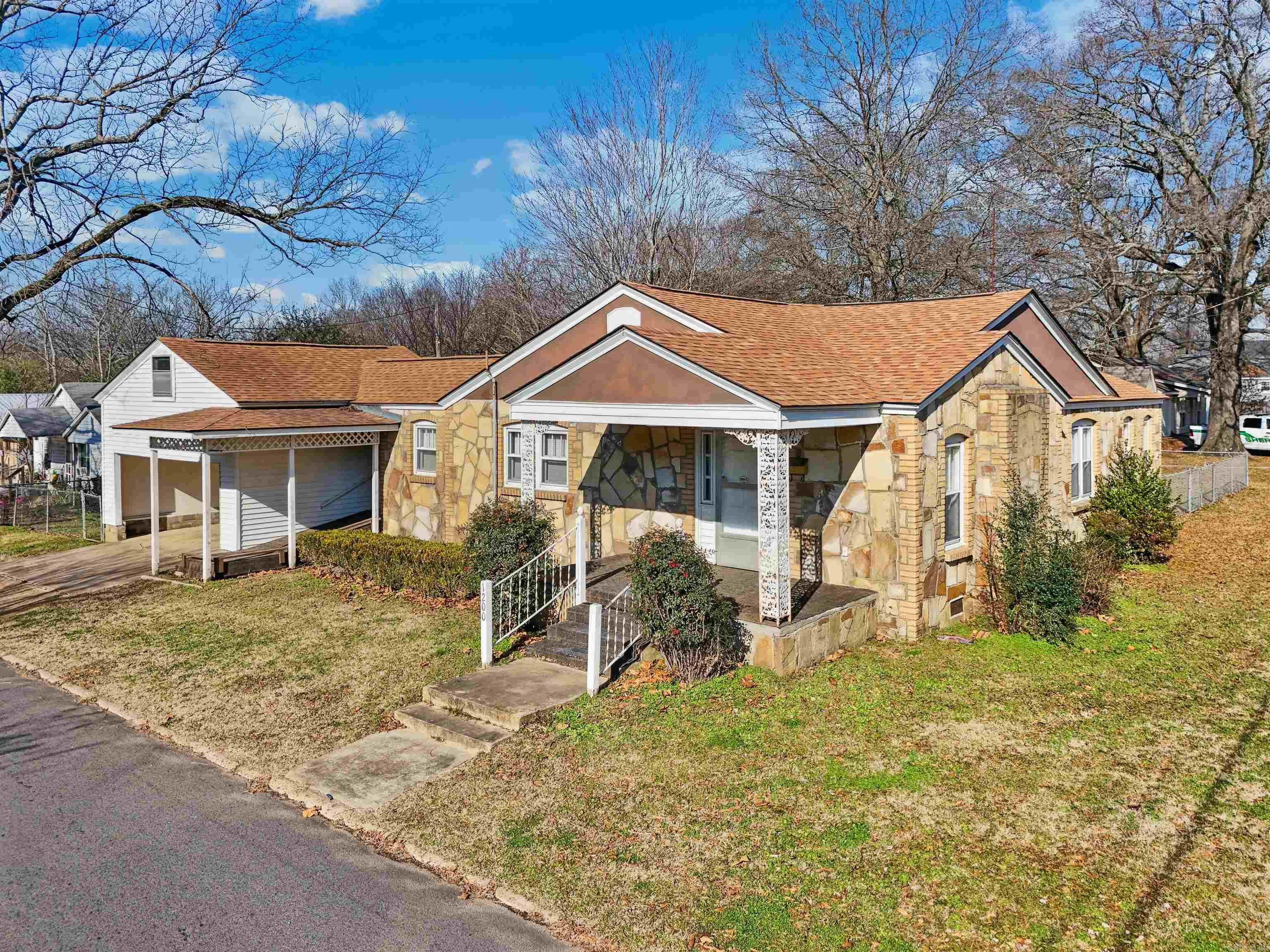 Absolutely charming home in the heart of Searcy! This 3 bed/1 bath home is 1479 sf, with original hard wood flooring in most areas, and a screened-in porch. There is also a storage area, fencing, electric fireplace, and a two car carport! Be sure to click the video links for the 3D tour and aerial drone footage. Agents see docs and private remarks for more info.