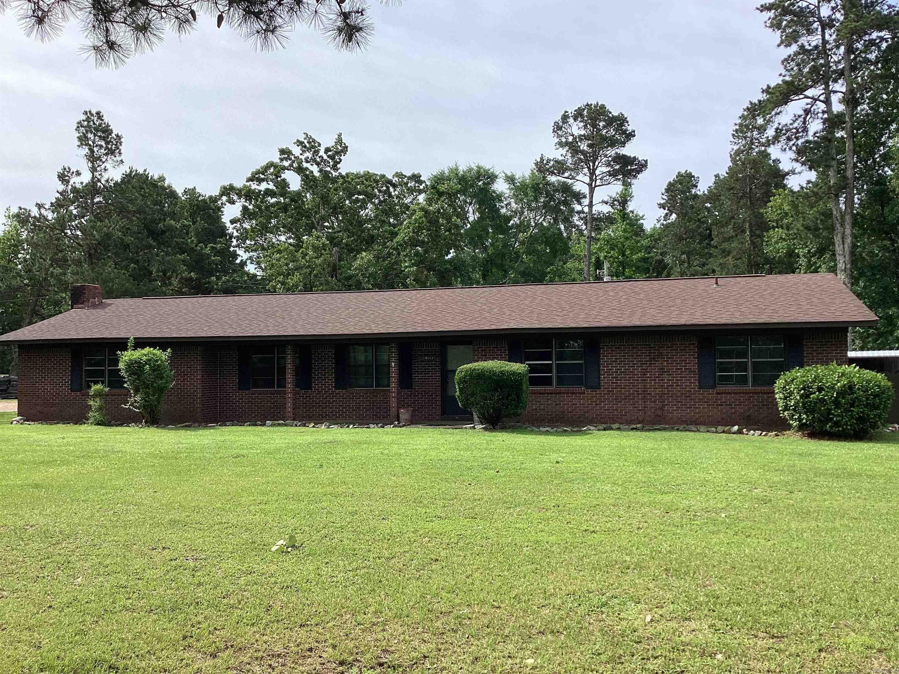 3 car carport, wood burning fire place. Beautiful brick home with plenty of storage having a 30x30 shop, and a 16x30 shed on back of shop. You get all this on 1.24 acres. Also paved road, 4 miles to interstate 30.