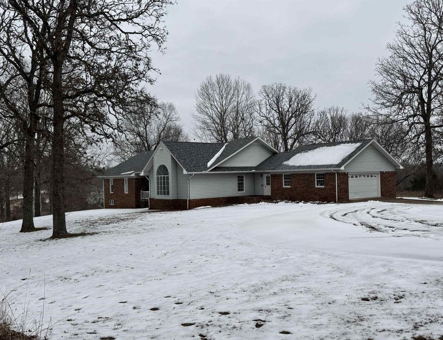 Custom large brick and vinyl home with 6 bedrooms and 3 1/2 baths. A partially finished basement provides additional room. Home is situated on 44.07 acres m/l and has a 44 x 22 shop garage, 32 x 32 metal barn, traditional style barn, lots of fencing, and a pond.