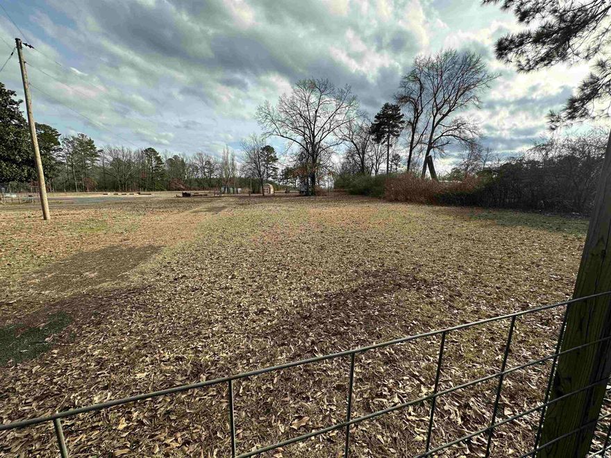 Pretty piece of land in a quiet area. Fenced, has water and electric and septic.   Has 12x20 Tuff shed with 3X6 Doors. There's a 2020 Rockwood travel trailer that can also be purchased ( see listing MLS# 23003706.