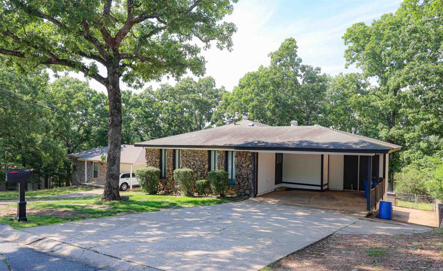 Nice 3/2 home with carport and lower level garage at rear entry of the home. Separate living/den. Split floorplan. Granite Countertops. Close proximity to Burns Park and I-40. Property is being sold as-is. Would be a great rental opportunity. Agents please see agent remarks.
