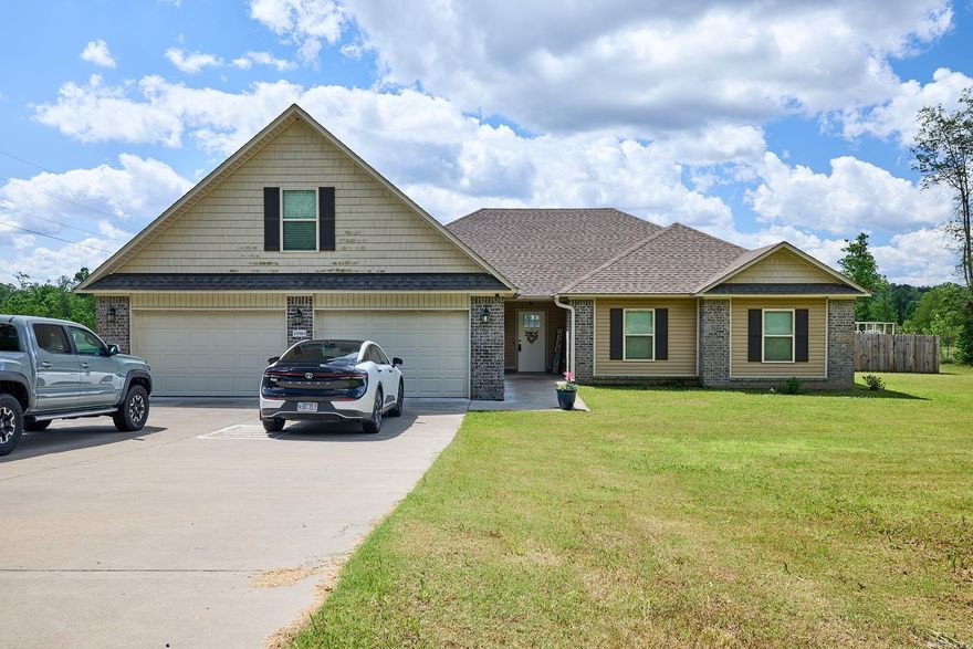 Experience the Best of Country Living! Welcome to this charming country retreat nestled on 3 beautiful acres. This spacious 4-bedroom, 2-bath home offers an open, split-bedroom floor plan designed for comfortable living.  Step into the large living area featuring a cozy fireplace—perfect for gathering with family and friends. The kitchen flows seamlessly into an eat-in dining space, ideal for casual meals or entertaining. All bedrooms are generously sized, with the primary suite offering a luxurious bath complete with a sunken soaking tub, separate shower, and dual closets.  The upstairs bonus room provides flexible space that can serve as a fourth bedroom, home office, playroom, or whatever suits your needs. A well-appointed laundry room includes a convenient soaking sink.  Enjoy peaceful mornings and quiet evenings on the covered back patio, overlooking a fenced yard that spans most of the acreage. With plenty of room to roam, garden, or simply enjoy the outdoors, this home is perfect for those seeking space, privacy, and tranquility. SEE AGENT REMARKS.