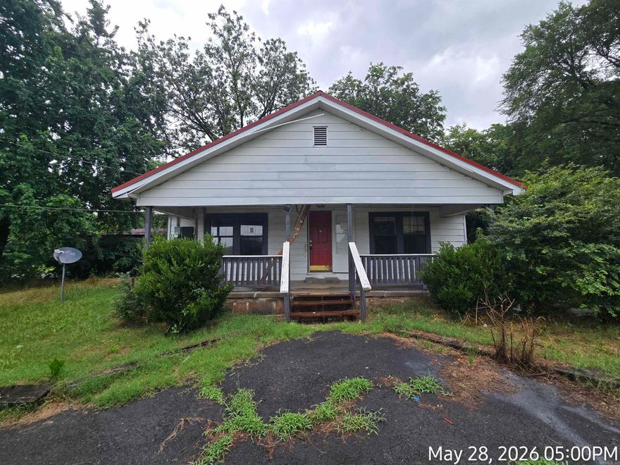 Looking for an investment property or a small project home? You just found it! This cute little bungalow could be 3 bedroom and a nice addition to your portfolio with a little work. This property features a screened back porch, 2 car garage, large storage building and a large corner lot. Agents read confidential remarks.