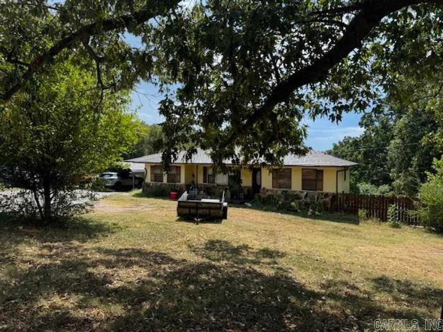 2000+ SQ FT HOME ON 2 ACRES!  This home has 3 bedrooms and 2 bathrooms including a master suite with private bath/laundry area. Formal living room. Kitchen/dining/den combo. Kitchen has tons of cabinets, island with cooktop and bar. Den and dining room have a gas log fireplace. Mud room and 1 car garage. Central heat and air. 2 car carport cover. Small deck and large dog pen. Well, septic system, Clay County Electric and Clay County Connect Fiber Optic Internet. 2030 square feet, just 8 miles to hospital and schools!