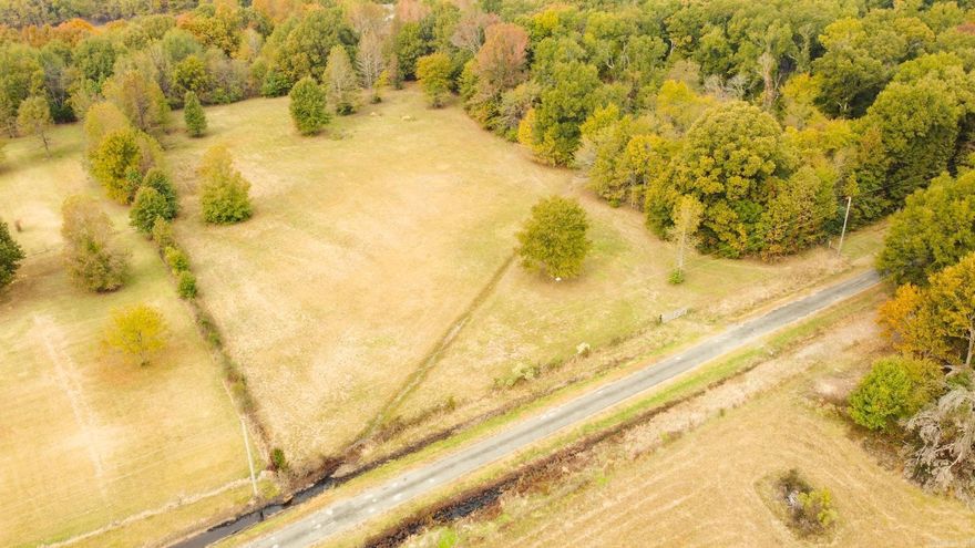 Gorgeous 3.44-acre lot, mostly cleared and fully fenced with a gated entrance ready for your dream home! Recent perc test completed, with water and electricity available at the road. See the attached plat and Bill of Assurance for full details.