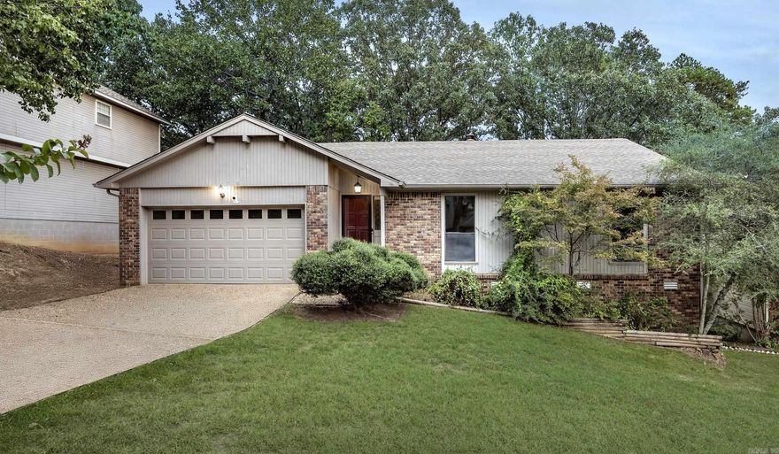 Bring your vision and make it your own! This 3-bedroom, 2-bath home in the desirable Marlowe Manor neighborhood offers over 1,500 sq ft of solid living space with endless potential. The welcoming floor plan features beautiful hardwood floors, vaulted ceilings with exposed beams, and a cozy brick fireplace that sets the stage for your next chapter. The spacious eat in kitchen including all appliances, with ample cabinetry is move in ready or provides a great foundation for your dream remodel.   Down the deck stairs, discover a heated and cooled bonus room with its own bathroom—not included in the square footage—perfect for a studio, workshop, or future guest suite. Enjoy a private, tree-shaded backyard ideal for quiet evenings or weekend gatherings. A newer whole-house generator ensures year-round comfort and reliability.  Whether you’re a first-time buyer looking for a great space or an investor seeking a great opportunity in West Little Rock, this home delivers the perfect blend of location, value, and potential.