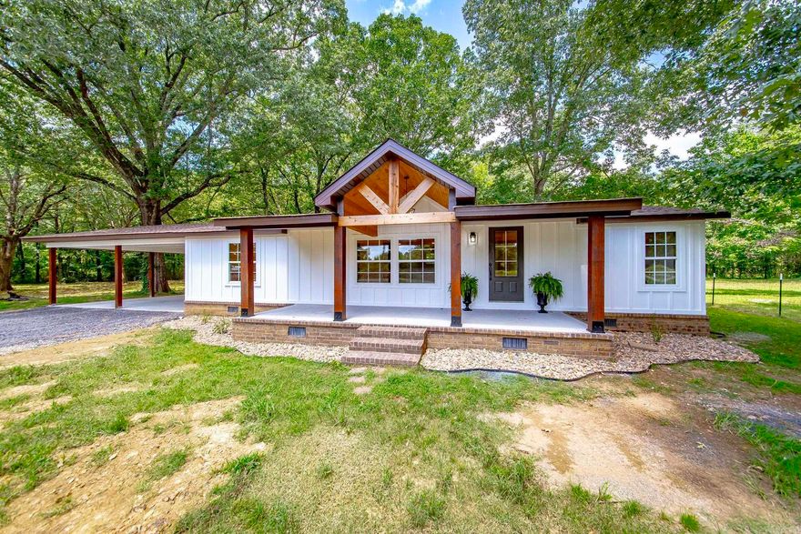 This breathtaking completely remodeled home is the perfect combination of country and chic. You’ll be blown away by the gorgeous hardwood floors and clean welcoming light colors throughout! The large covered front porch welcomes you to this home walking into the living room With vaulted ceilings flowing in to the dining room and kitchen with a seamless open concept for hosting guests. This split floor plan offers privacy with your oversized primary bedroom and stunning bathroom with walk-in shower. Guest bedrooms and a full bathroom are conveniently located off a short hall from the living space. Walking through the kitchen you’ll find granite counter tops, stainless steel appliances and an island with breakfast bar! Continuing through you’ll find a spacious laundry leads you tot be outdoor retreat you’ve been looking for! Enough carport space for more than just your vehicles and the tree line is perfect for a personal get away in your back yard! Agents see remarks.