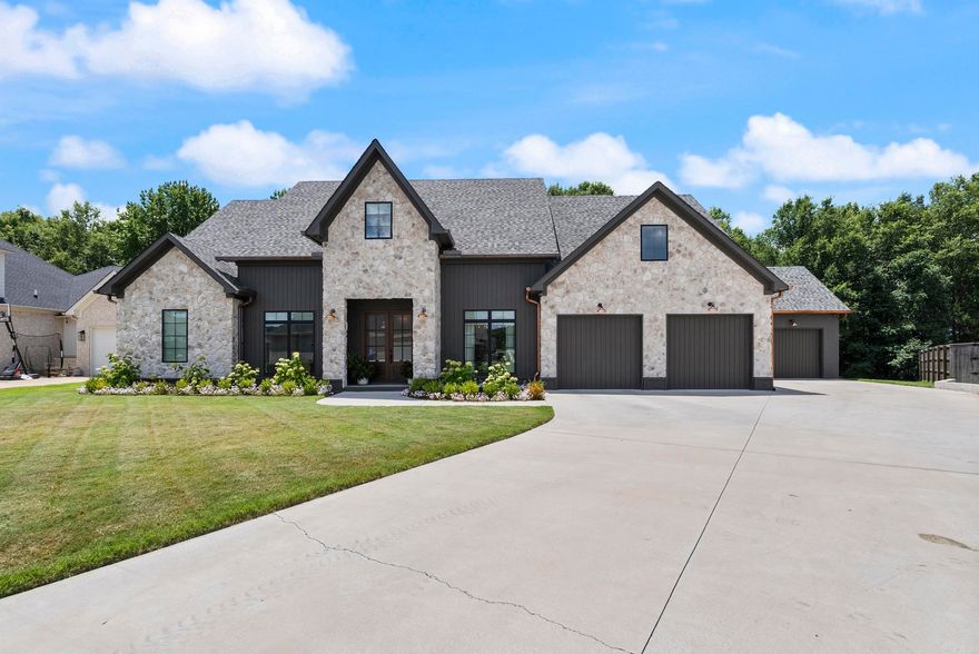 Step into refined elegance in one of Conway’s most desirable neighborhoods. This exquisite custom-built home offers over-the-top upgrades, an energy-efficient design, and a layout perfect for everyday living or entertaining in style. The open-concept kitchen stuns with floor-to-ceiling Custom Cabinetry, Quartzite countertops, a walk-in pantry, butler's pantry, Gas Stovetop w/ Pot Filler, Double Ovens, and a Spacious island that anchors the heart of the home flowing to the living room featuring the fireplace, designer finishes, and expansive windows that invite in natural light.  Retreat to the primary suite on the main level of the home with a spa-worthy en-suite bath featuring double vanities, a soaking tub, and an oversized walk-in shower. Don’t miss the dreamy closet with built-in storage and center island.   The Secondary bedrooms are generously sized with ample closet space and beautifully appointed bathrooms. Additional highlights include indoor Safe room, dedicated home office, formal dining room, and a private, wooded backyard oasis. The expansive covered patio sets the stage for quiet morning coffee or relaxing evening gatherings. Let's make this one your next home!
