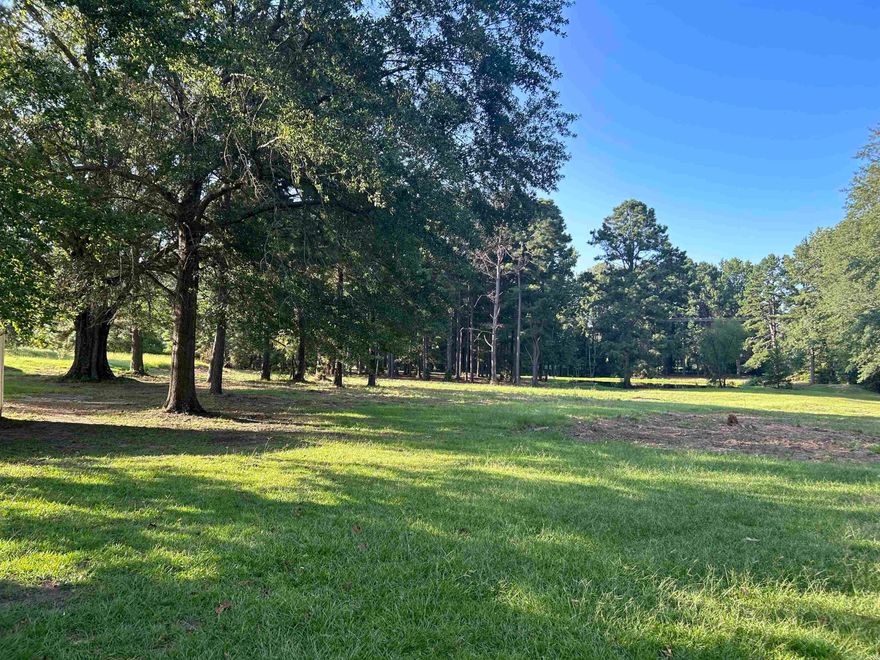 Beautiful 4.5 acres of land with gorgeous mature trees, and your own private pond. This is such a peaceful and serene setting, and conveniently only 1.5 miles into Sheridan. There is a perfect spot toward the back to build your dream home with the pond just behind it.