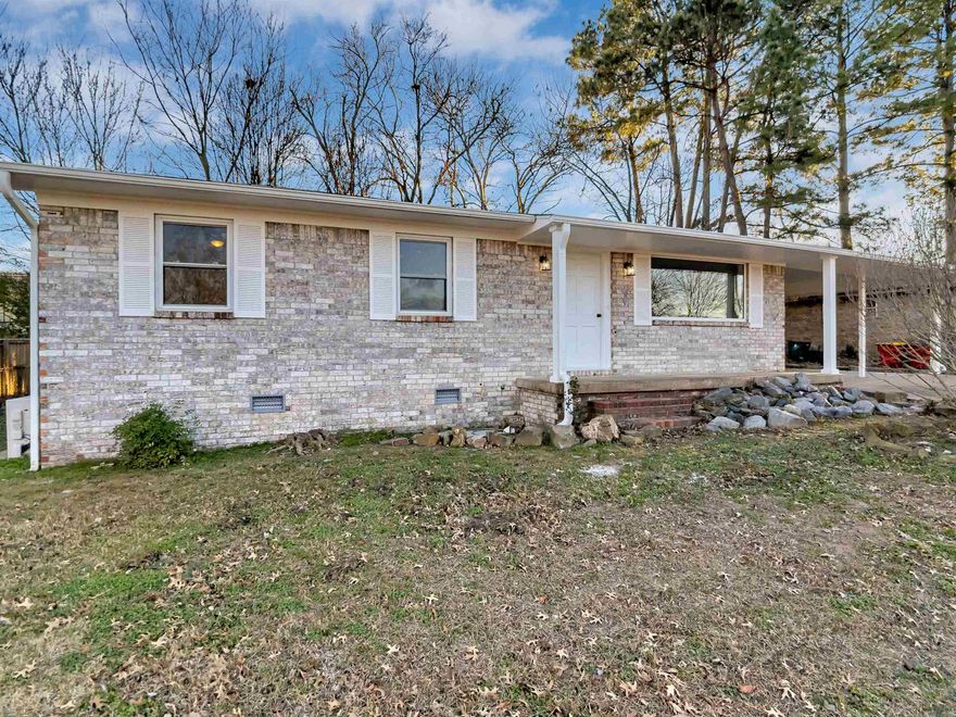 Located in a well-established neighborhood at the city's heart, this recently updated 3/2 home blends classic charm and modern amenities. The house features new flooring and plush carpet, complemented by updated light and plumbing fixtures that add a touch of elegance. The renovated kitchen and bathrooms showcase contemporary design and functionality, perfect for everyday living and entertaining. Outside, a covered back deck offers serene space for relaxation, overlooking a private, fenced backyard.