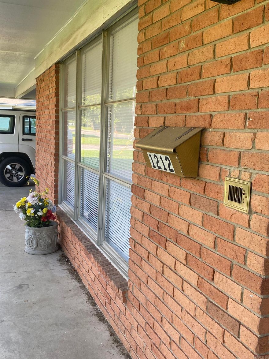 Corner lot in the city limits of Conway.  It is located on the corner of Donaghey Ave 150 'wide front.  The home has good bones to it but has not been up dated.  Seller is selling the property as is. It is presently zoned as R-2A. See additional MLS to buying more land.