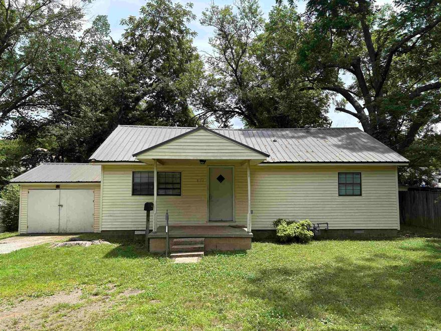2Br / 1BA.  Extra room off the kitchen.  Garage / outbuilding.  Water heater is two years old. Trance heat / air is six years old.  Metal roof is eight years old.  Has been used as a rental for almost twenty years and most recently rented for $875 per month.