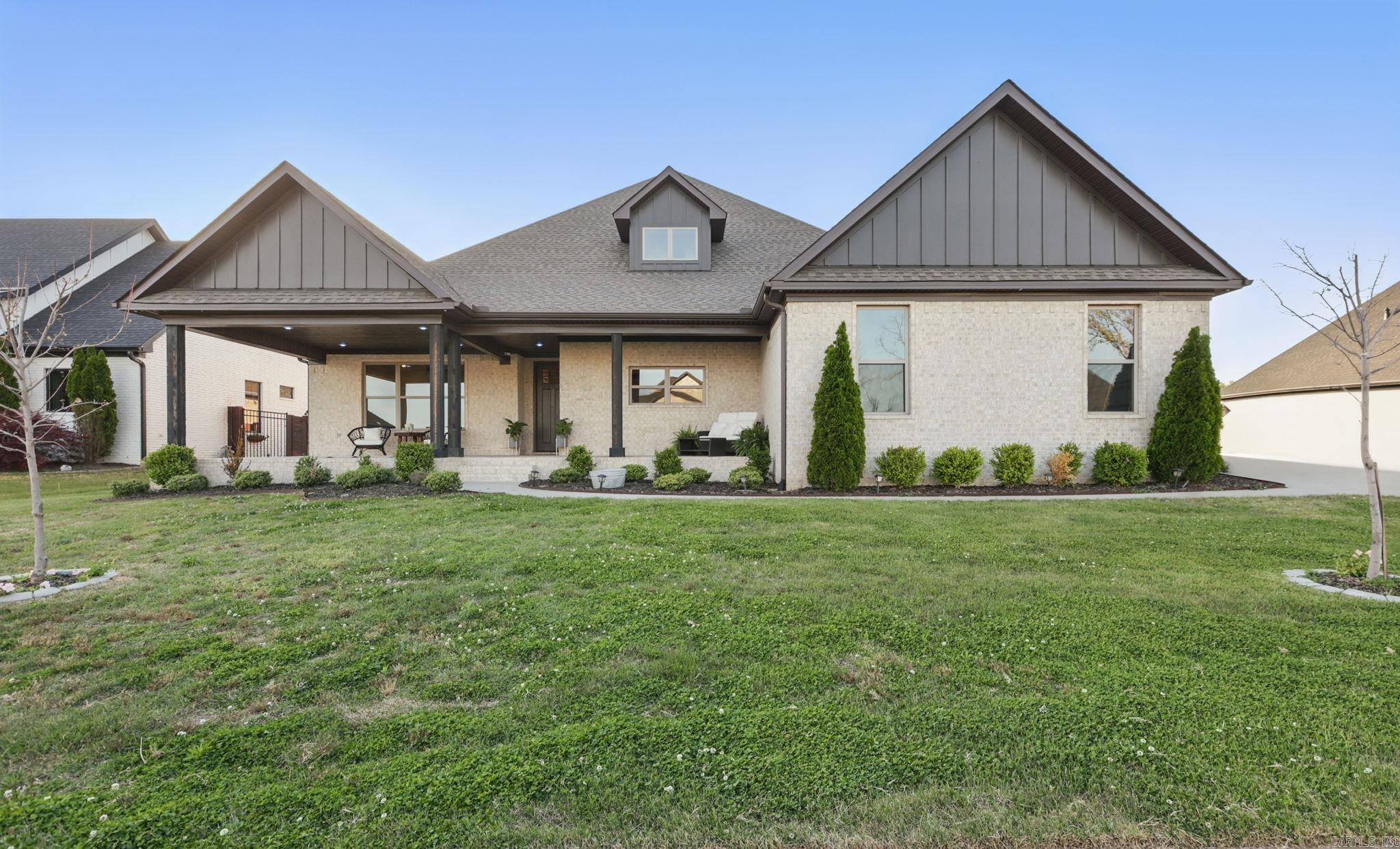 One - level home with all the luxury in a gated community giving maximum efficiency in the open floor plan with vaulted beams in living area. 4 bedrooms, 5th room could serve as additional bedroom, office or reconstruct to a formal dining room as the immaculate view of the lake is going to be breathtaking in any capacity. Walk-in closets to every bedroom. 3 full baths and half bath. Grand chef kitchen, also with a view, gas stove, double oven and walk-in pantry. Laundry and mudroom directly off of the 3-car garage. Front porch is your outdoor oasis giving the perfect spot to relax and enjoy summer evenings as well as the covered back porch with fireplace.