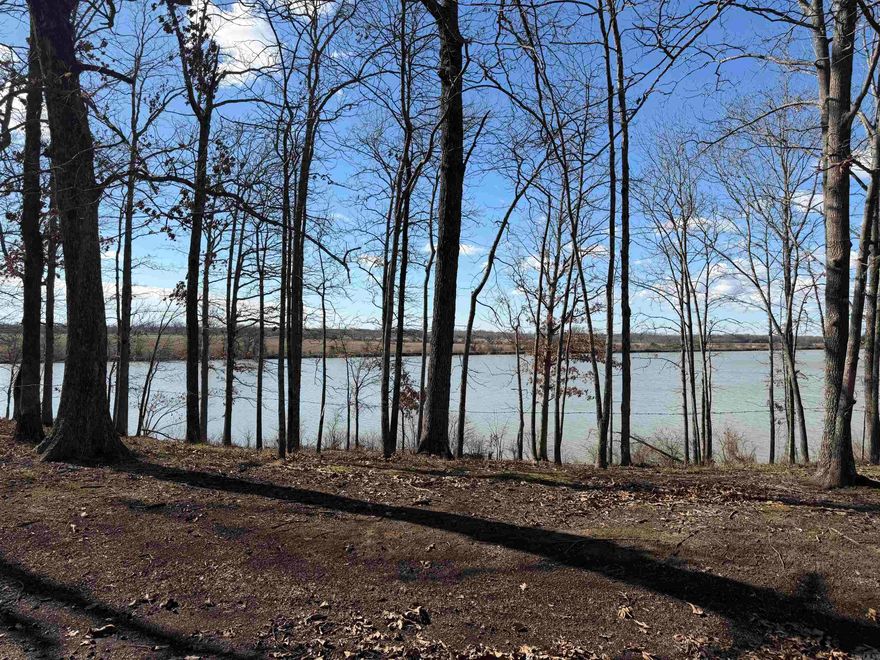 Discover the perfect setting for your dream home or weekend retreat with this beautiful 0.8-acre level lot facing Marks Lake. Nestled among mature hardwood trees, this property offers a peaceful, natural backdrop with picturesque lake views just across the road. The lot is mostly level, making it well-suited for building, and features a serene wooded landscape that provides privacy while still allowing filtered views of the water. Towering trees and a quiet, park-like atmosphere create an ideal environment for nature lovers, outdoor enthusiasts, or anyone seeking a tranquil escape. Whether you envision a custom home, cabin, or investment property, this land offers the rare combination of lakefront setting, buildable terrain, and natural beauty. Enjoy morning walks, wildlife sightings, and the calming presence of Marks Lake just steps away. A great opportunity to own a scenic piece of land in a peaceful lakeside setting.