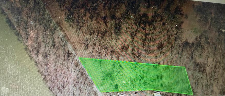 Build your lake home on this beautiful (.82 +/-) wooded flat lot on Mark's Lake. Concrete pad still on property from previous home. Utilities on property. It's so close to the lake.
