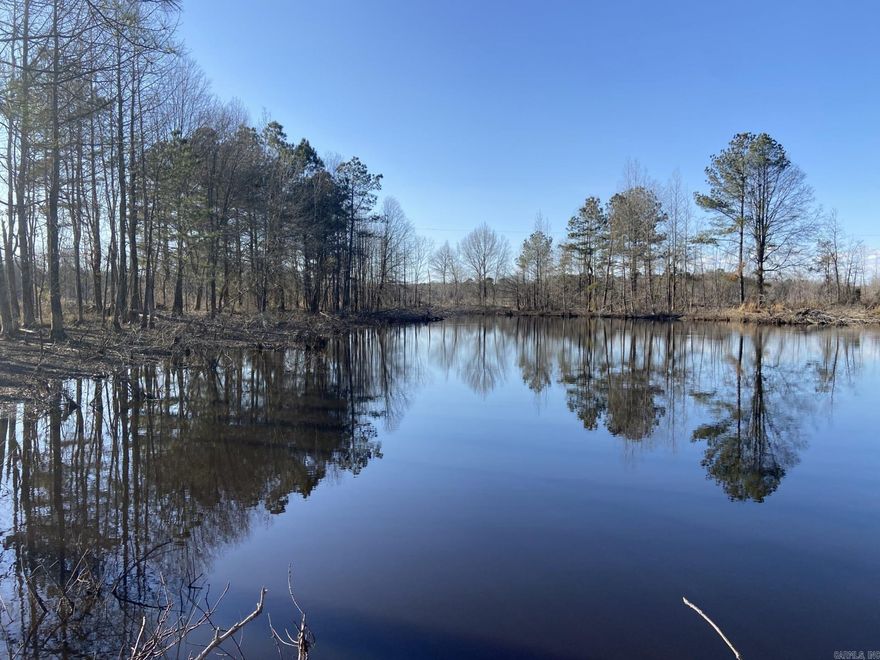 Located in Hempstead County near the community of Ozan, AR lies this cabin ready hunting property just down from the Ozan Wildlife Management Area. Ozan B features a picturesque pond surrounded by towering pine and hardwood trees which would make a great spot for your home or cabin. This Arkansas land for sale has frontage on CR 333 and CR 294 with electric available. A pine plantation was planted in 2022 that has the potential to produce a return on your investment. This area is known to hold a lot of big deer as well as turkey. The property is within striking distance of several great fishing lakes and duck hunting opportunities as well. If you are looking for a good long term timber investment, small hunting tract, homestead, or a convenient place to get away from it all, you may feel right at home in Ozan. This one checks a lot of boxes and additional acreage is available.  Seller to retain mineral rights.