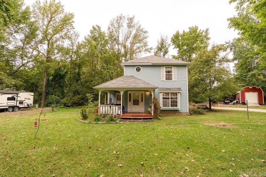 Adorable Two story home on Cul-De-Sac.  Wraparound covered front porch is wonderful to enjoy mornings and evenings.  Entry level contains living and dining combo, kitchen, laundry, pantry, and half bath.   Upper level has full bath and two bedrooms with walkout access to large deck.  Oversize Primary Bedroom is suitable for use as a sitting area or home office.  New HVAC in 2015 and Roof replaced in 2016.  Electricity for RV hookup and in storage building.