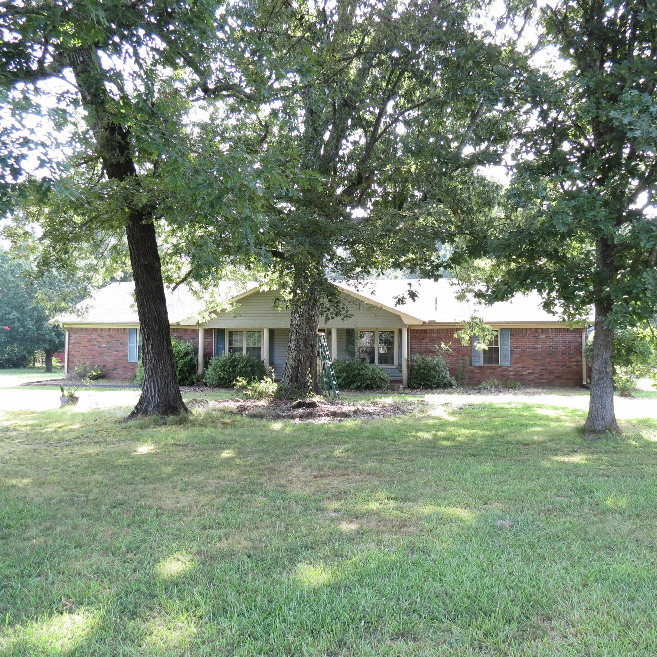 This sprawling 36 acre property features a 3 bedroom 2 1/2 bath home sits back off the road with a long tree lined driveway, perfect for your privacy. This home has vaulted ceilings, 2 living areas, lots of storage, large walk in closets, split floor plan. This property also has a rustic bunk house ideal for guest or in-laws. Large barn with stalls and tack room, tractor shed, shops, fenced and cross fenced, large pond. Bring your livestock. This vast acreage also presents opportunities for gardening or simply enjoying the serenity of country living. Endless possibilities. Call today to tour. *Agents See Private Remarks*