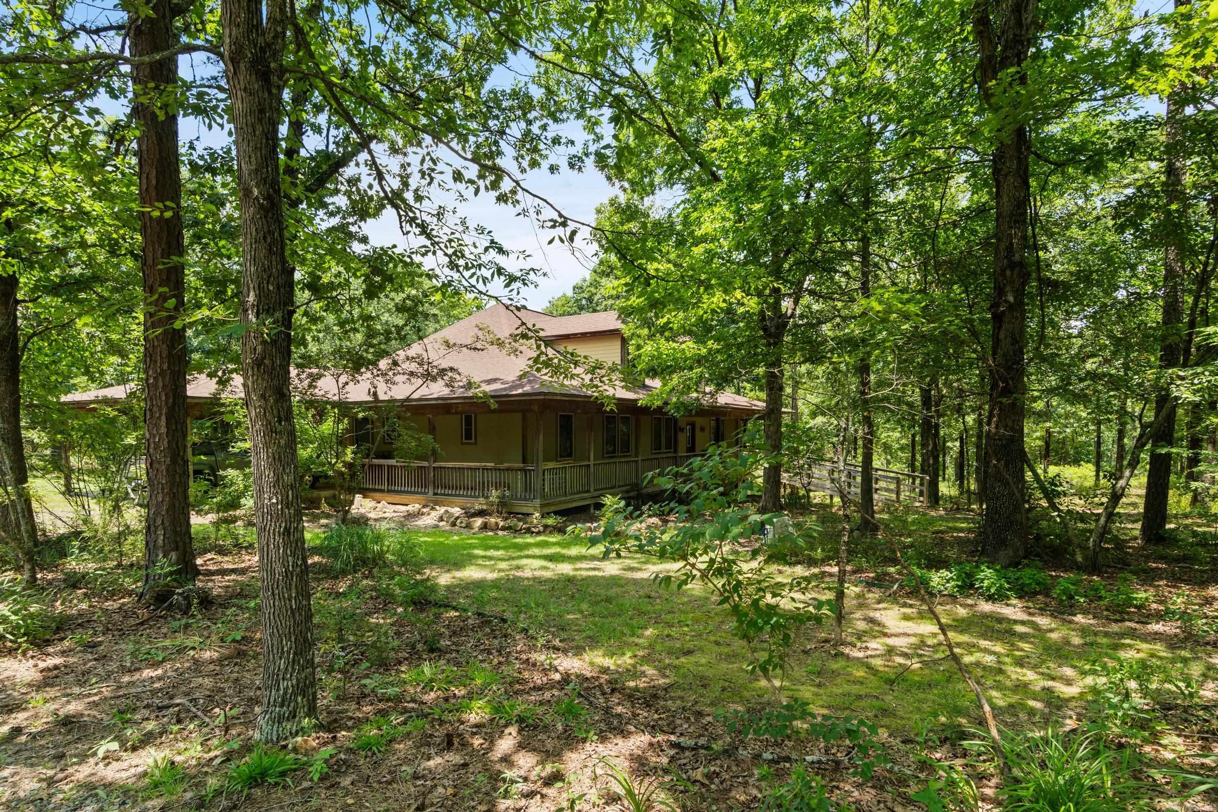 A CUSTOM-BUILT HOME THAT SITS ON 1.80 ACRES, NESTLED IN THE TREES IN SOUTHWEST CONWAY. THIS TOTAL ELECTRIC HOME HAS PORCHES ON 3 SIDES, A CARPORT, GARAGE, STORAGE BUILDINGS AND IS FENCED. THE MAIN FLOOR HAS 2 BEDROOMS 1.5 BATHS. ONE FULL BATH HAS A TUB AND THE OTHER FULL BATH HAS A CUSTOM WALK IN SHOWER. THE MAIN FLOOR HAS 1970 SQ FT H&C, WHILE THERE IS AN ADDITONAL 400 SQ FT UPSTAIRS THAT CURRENTLY IS NOT HEATED AND COOLED. THERE IS AN UNFINISHED BASEMENT THAT HOUSES THE MECHANICALS OF THE HOME. THE KITCHE HAS AN ISLAND WITH A PREP SINK, AN ABUNDANCE OF CABINETS AND HAS AN OPEN CONCEPT LIVING CONCEPT. THERE IS ALSO A FLEX SPACE. THE MUD ROOM HAS AN EXTERIOR DOOR FOR EASY ACCESS TO CLEAN UP WHEN COMING FROM THE OUTSIDE. THERE IS A FEMA SAFE ROOM ON THE MAIN FLOOR. **SEE APPOINTMENT INSTRUCTIONS**