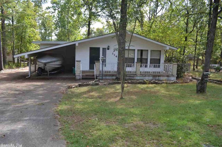 Cute as a bug lake home w/detached garage. Has extra room in back of garage w/electricity that could be extra bedroom or work-shop. Kitchen w/bar looking into Living Room + large windows & vaulted ceilings make it open, light & airy. Master bedroom has access to deck & room just off large laundry room has no closet, but can be used as 4th b/room. Not Lakefront, but SO close to Hamilton Hills boat launch is only .1 tenth of a mile & a couple of minutes walk. 2nd picture shows boat launch. Marina close too.