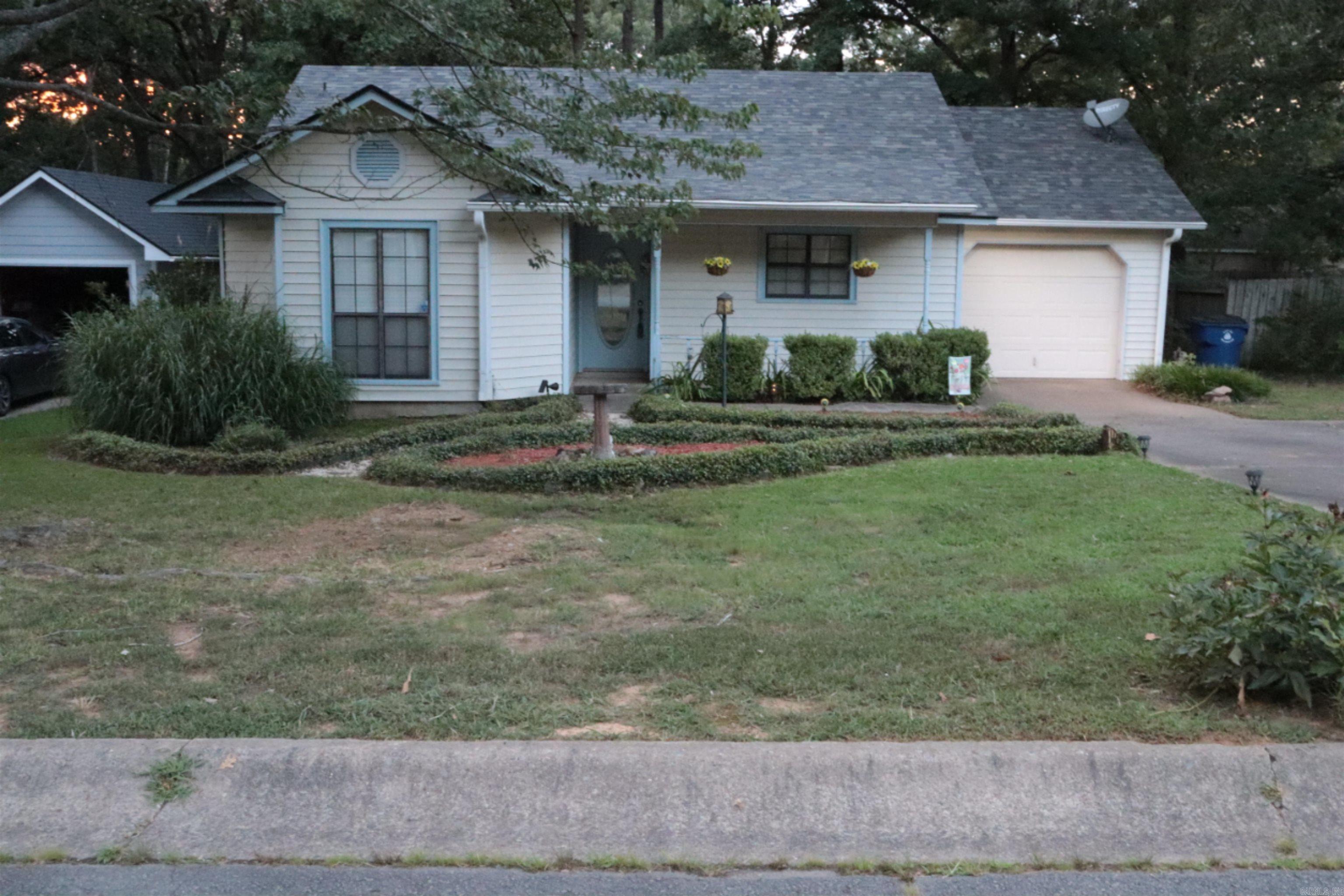 Check out this charming two-bedroom, two-bathroom home in the desirable Rolling Oaks Subdivision! Featuring a spacious, open floor plan, this home offers a large living area with a cozy gas fireplace, perfect for relaxing or entertaining. Additional highlights include a one-car garage, a welcoming front porch, a deck ideal for outdoor gatherings, and an outdoor storage shed for added convenience. Enjoy the benefits of a tankless water heater, a newer roof (less than 5 years old), upgraded kitchen countertops, and an updated bath and shower. The refrigerator, washer, and dryer are all staying with the home.